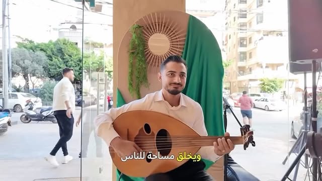 An oud player at OUD's opening